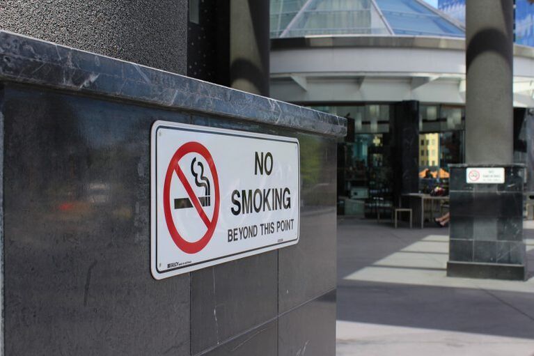 Prohibit smoking in public places and encourage quitting